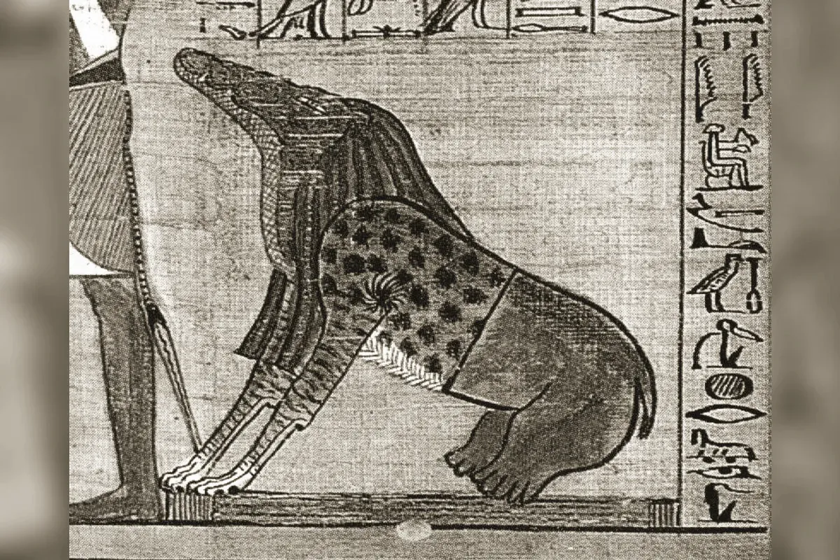 Ammit, a composite creature with a crocodile's head, a lion's chest and a hippopotamus's hindquarters, waiting beside the scale of judgment