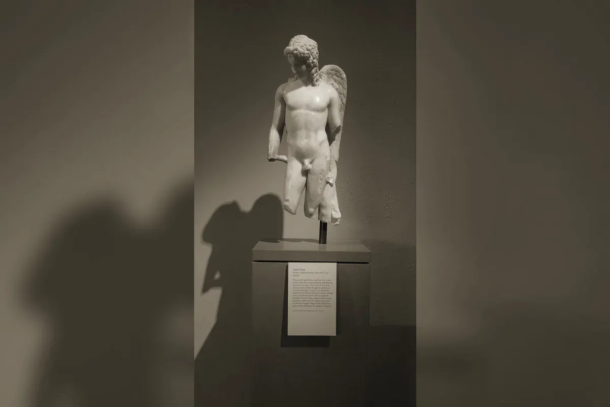 Winged Eros, Greek god of desire, depicted with his bow and arrows in an ancient context